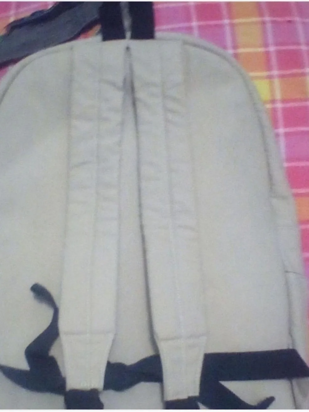 Cream colored Rowdy Crowd backpack NWT has Turquoise Patterned Front Pocket